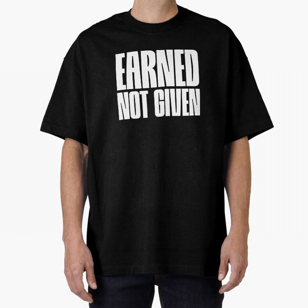 Earned not given white Oversized T-Shirt Celebrate Football Dreams Across Global Football Passion for FIFA World Cup 2026 Group Stage, Driven by Messi, Neymar and Mbappe, Brazil, Portugal and Argentina, Goal Celebration Energy, Supporter Heritage,